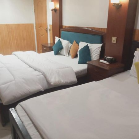 Hotel New Mid City Мултан Екстериор снимка